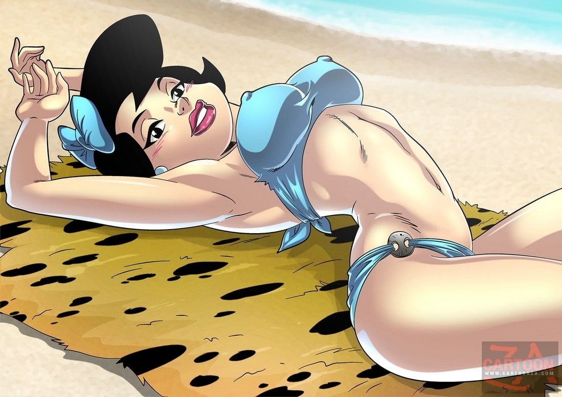 Betty Rubble posing on a beach